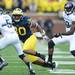 Michigan safety Thomas Gordon runs down Northwestern tailback Vernic Mark during the third quarter at Michigan Stadium on Saturday. Melanie Maxwell I AnnArbor.com